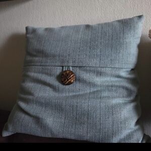 Blue Throw Pillow with Button Accent